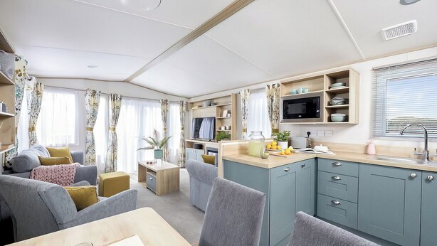 A compact living space with a dining area, kitchenette, and seating area. - Platinum 3 Pet Friendly (Clunderwen, Nr Narberth)