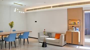 Executive Room | Living area | 55-inch Smart TV with digital channels