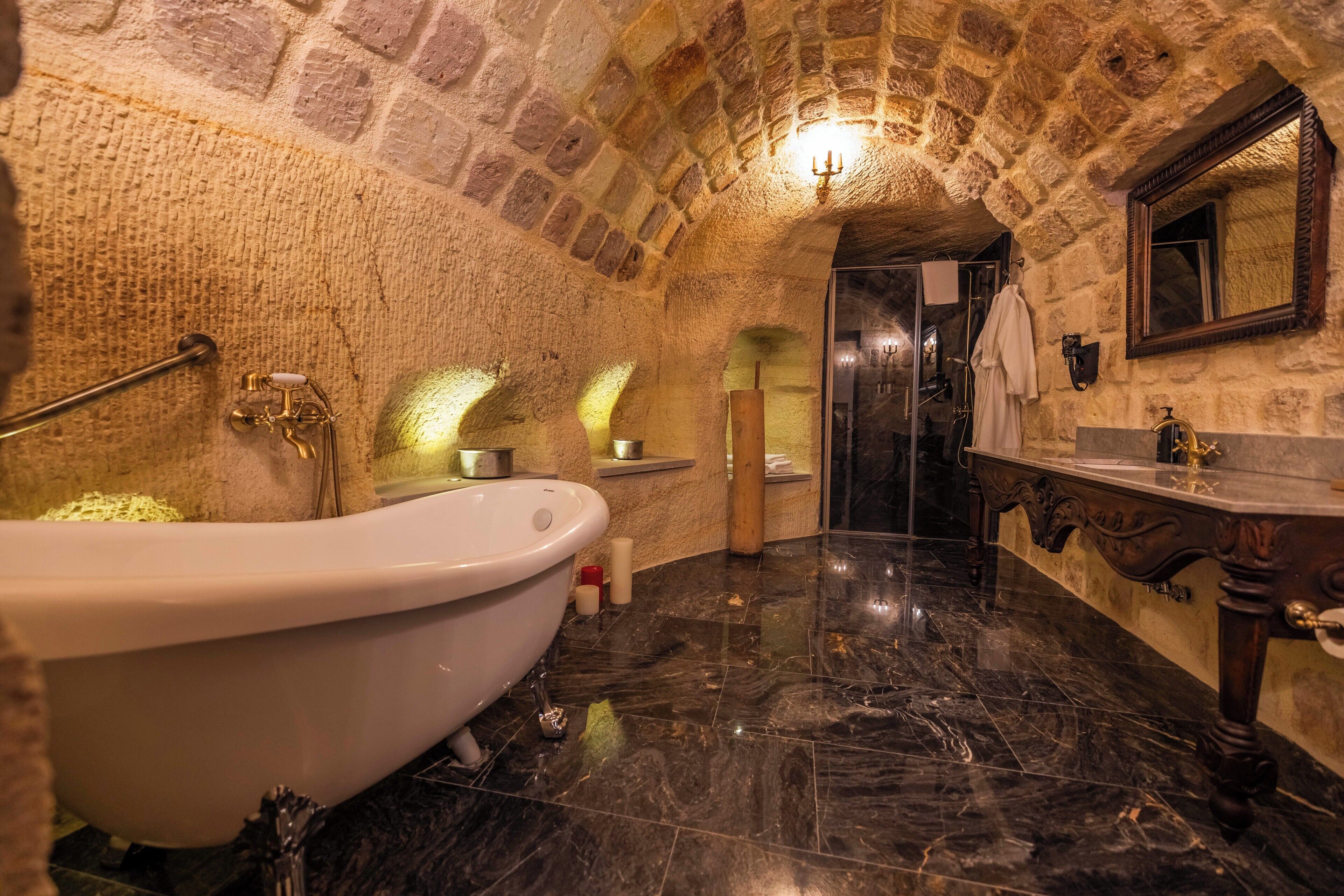 Separate tub and shower, designer toiletries, hair dryer, bathrobes