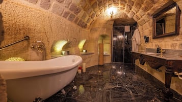 Separate tub and shower, designer toiletries, hair dryer, bathrobes