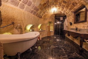 Separate tub and shower, designer toiletries, hair dryer, bathrobes