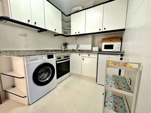 Microwave, coffee/tea maker, toaster, cookware/dishes/utensils