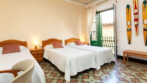 A hotel room with two beds, a bench, and a view of the outside. - Apartment Baldri by Interhome (Tossa de Mar)