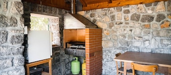 Traditional old house in a peacefull small village, surrounded by green forests.