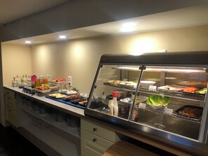A buffet area with a variety of food items and condiments. - Jølster Lake View (Sunnfjord)