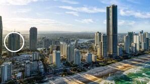 A coastal cityscape with high-rise buildings, a beach, and a river. - `The Ocean Breeze Getaway` by Inn Paradise (Surfers Paradise)