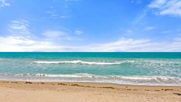 On the beach, sun loungers, beach towels