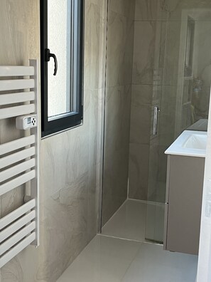 Shower, hair dryer, towels, soap