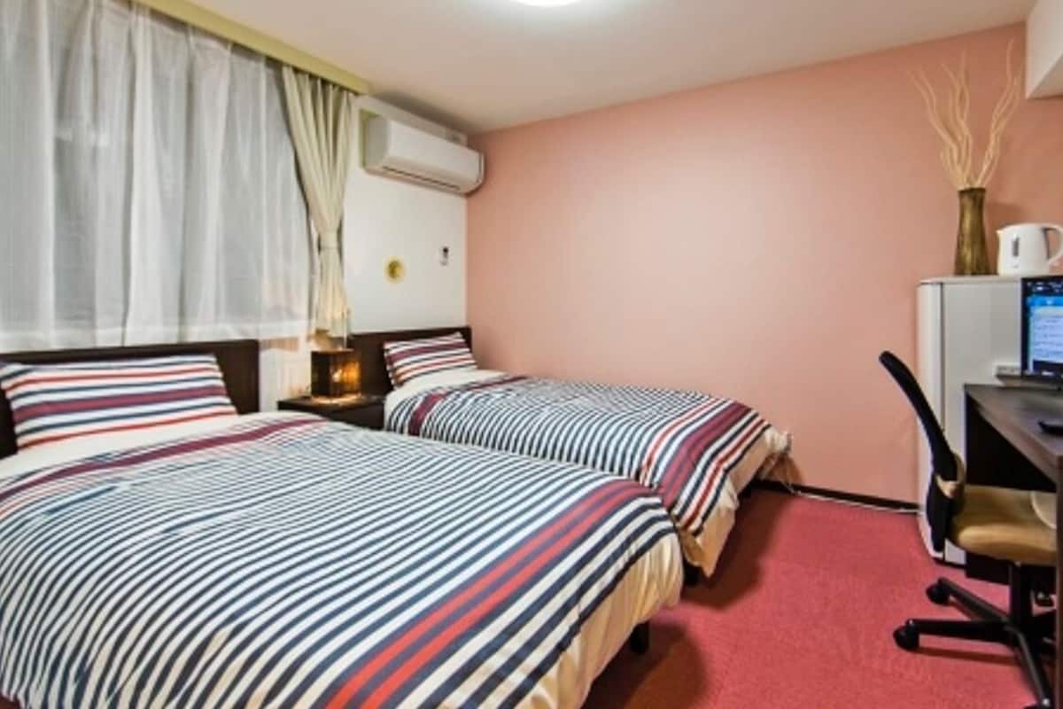 Twin Room | Desk, iron/ironing board, free WiFi, bed sheets