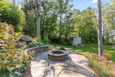 Relaxing retreat on Rice Lake! Quiet lake views w/full deck, fire pit, & hot tub