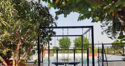 Idyllic Getaway Amidst Guava And Mango Trees