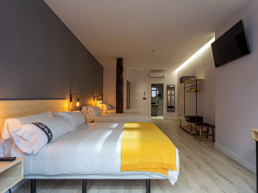 Family Quadruple Room, Balcony, City View | Memory-foam beds, in-room safe, desk, laptop workspace