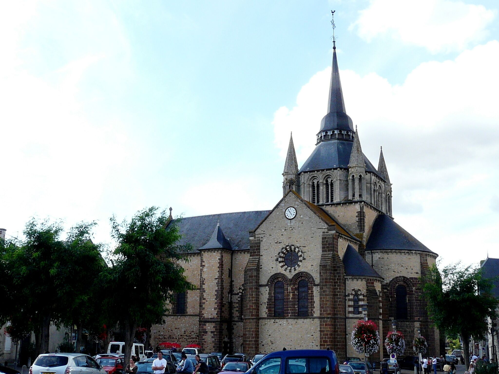A historic church with a tall spire and a clock tower.