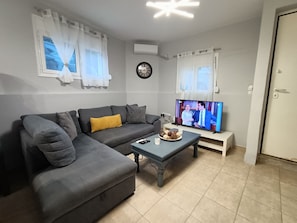 Lägenhet City | Vardagsrum | 55-tums smart-tv med satellitkanaler