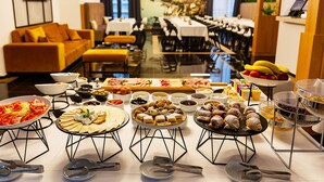 A buffet with various food items and utensils. - Hotel Boka (Radanovici)