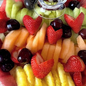 A fruit salad with strawberries, grapes, and melon pieces. - Kennebunkport Motor Lodge (Kennebunkport)