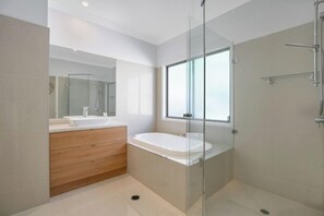 Shower, hair dryer, towels, toilet paper