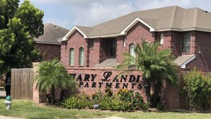 A brick building with a sign that reads "MARY LANDING APARTMENTS". - Sharyland Townhome - 2/2.5 bedrooms with patio in McAllen (McAllen)