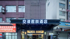 A hotel entrance with a modern facade, glass doors, and a visible reception area. - Baiyun Airport Grand Hyaat Airport Hotel - 24-hour Free Shuttle Bus (Guangzhou)