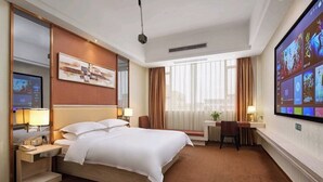 A hotel room with a large bed, a desk, a television, and a window with curtains. - Baiyun Airport Grand Hyaat Airport Hotel - 24-hour Free Shuttle Bus (Guangzhou)