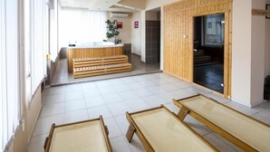 A hotel lobby with a reception desk, wooden steps, and a reception area. - Sharkov Family Hotel  (Garmen)
