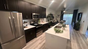 Signature Condo, 1 Bedroom, Balcony | Private kitchen | Fridge, microwave, oven, stovetop