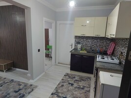 Apartamento básico | Cozinha privada | Geladeira, fogão, cooktop, chapa