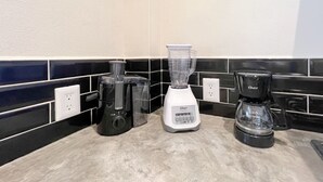 A kitchen counter with a blender, a coffee maker, and a kettle. - Best Location + Clean, Safe, Just Built (Sayulita)