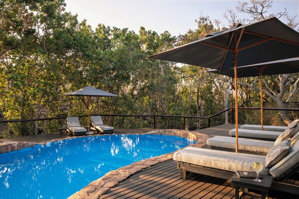 Outdoor pool, pool umbrellas, pool loungers