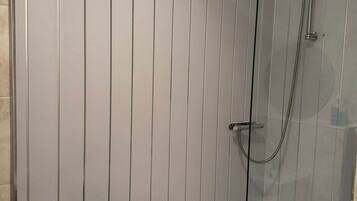 Shower, towels, soap, toilet paper