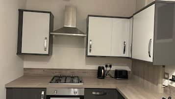 Fridge, microwave, cookware/dishes/utensils, dining tables