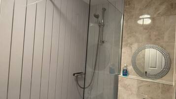 Shower, towels, soap, toilet paper