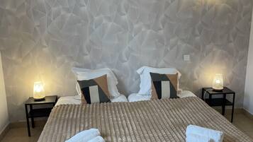 Premium bedding, desk, laptop workspace, soundproofing