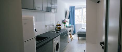 Fridge, microwave, cookware/dishes/utensils, spices