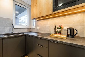 Fridge, microwave, stovetop, dishwasher - Kasprzaka29 - City View, 9th Floor, Expo by Rentujemy (Warszawa)