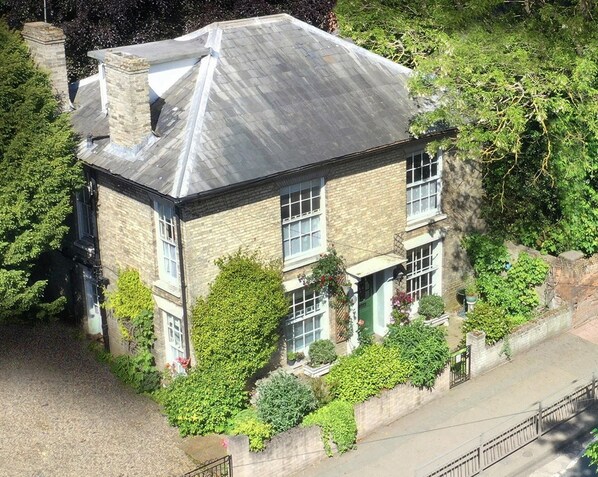 A two-story building with a sloped roof, large windows, and a brick facade. - Billericay Georgian House, Sleeps 6 - Pet Friendly (Billericay)