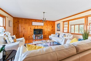 Relax in this stylish living room with a comfortable sofa, coffee table, and TV.
