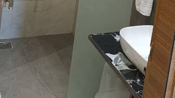 Shower, rainfall showerhead, towels, soap