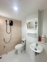 Shower, rainfall showerhead, hair dryer, towels