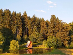 Situated on the lake's edge, this cabin offers serene views of the surrounding forest.