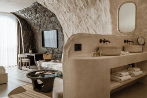Cave Suite Caldera View with Private Pool | Living area | 65-inch flat-screen TV with satellite channels