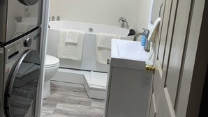 A compact bathroom with a toilet, sink, and a bathtub. - Located right at the center of Elizabethtown , Lancaster, York and Hershey park. (Elizabethtown)
