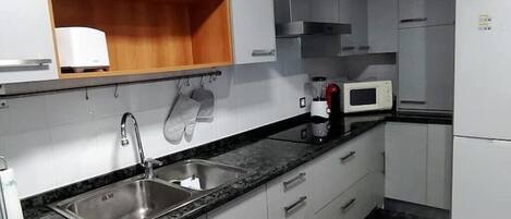 Fridge, microwave, stovetop, coffee/tea maker