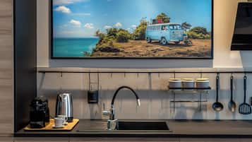 Deluxe Apartment | Private kitchen | Fridge, stovetop, coffee/tea maker, electric kettle