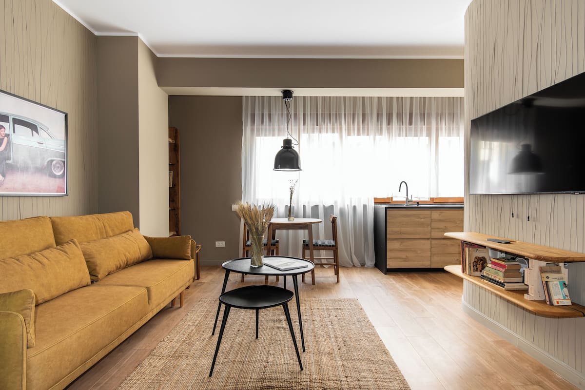 Appartement, 1 chambre | Aire de séjour | Téléviseur