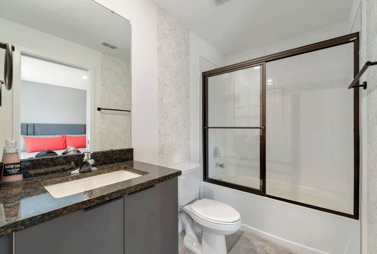 Shower, hair dryer, towels, shampoo