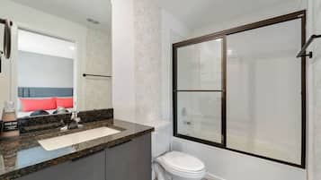 Shower, hair dryer, towels, shampoo