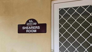 A door with a sign above it that reads "Tanwatra Lodge Shearers Room".