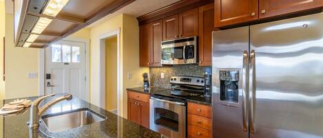 Microwave, dishwasher, coffee/tea maker, cookware/dishes/utensils