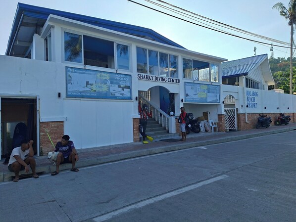 A building with a sign for 'SHARKY DIVING CENTER' and 'BOLABOG BEACH RESORT'. - Bolabog Beach Resort (Boracay Island)